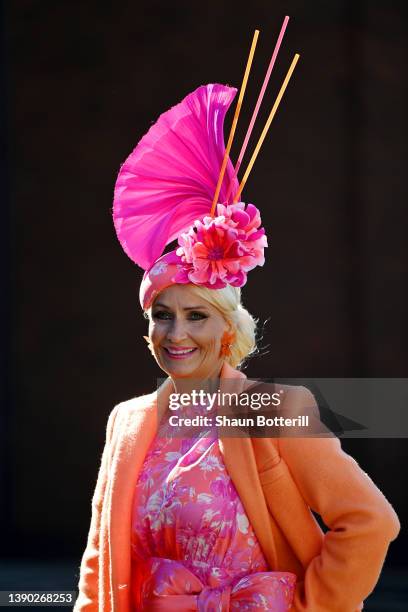 Spectator poses for a photo during Ladies' Day at Aintree Racecourse on April 08, 2022 in Liverpool, England.