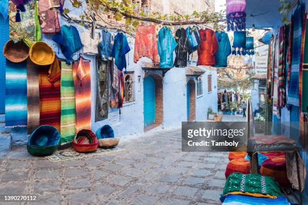 morocco, chefchaouen, souvenirs for sale at traditional blue houses - chefchaouen medina stock pictures, royalty-free photos & images