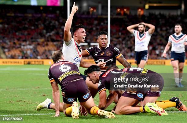 Joseph Manu of the Roosters celebrates scoring a try during the round five NRL match between the Brisbane Broncos and the Sydney Roosters at Suncorp...