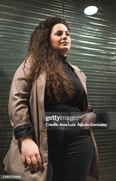 confident plus size woman in outerwear - plus size fashion stock pictures, royalty-free photos & images