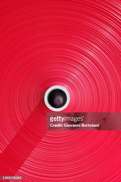 reels of heat shrink red film,  recycled plastic, made with high quality recycled polymers - polimero foto e immagini stock