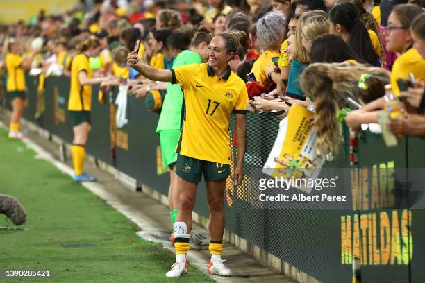 Kyah Simon of Australia takes selfies with fans after her team's victory during the International Women's match between the Australia Matildas and...