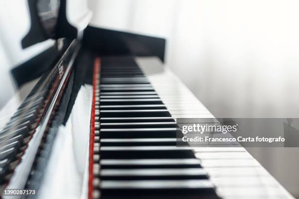 close-up of piano keys - piano keys stock pictures, royalty-free photos & images