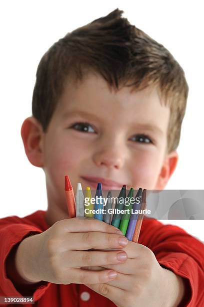 child holding crayons - kid holding crayons stock pictures, royalty-free photos & images