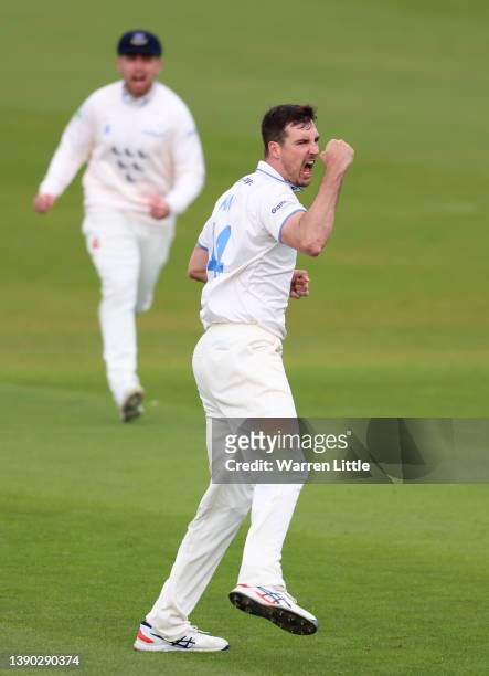 Steven Finn of Sussex celebrates dismissing Joe Clarke of Nottinghamshire during the LV= Insurance County Championship match between Sussex and...