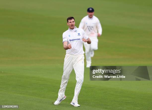 Steven Finn of Sussex celebrates dismissing Joe Clarke of Nottinghamshire during the LV= Insurance County Championship match between Sussex and...