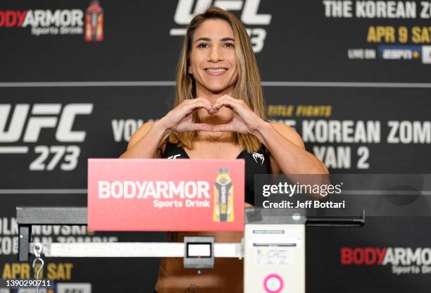 Tecia Torres poses on the scale during the UFC 273 official weigh-in at the Hyatt Regency Riverfront Hotel on April 08, 2022 in Jacksonville, Florida.