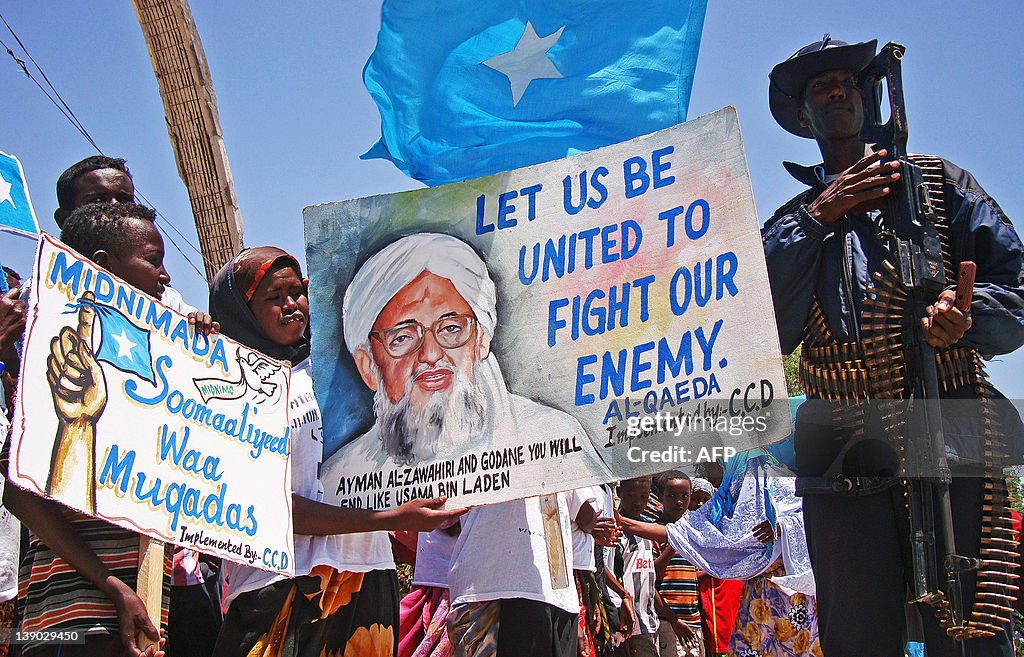 Somalis hold placards as they demonstrat