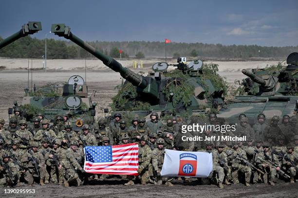 Troops from the Polish 18th Mechanised Division and the 82nd Airborne Division take part in tactical and fire training on April 8, 2022 in Nowa Deba,...