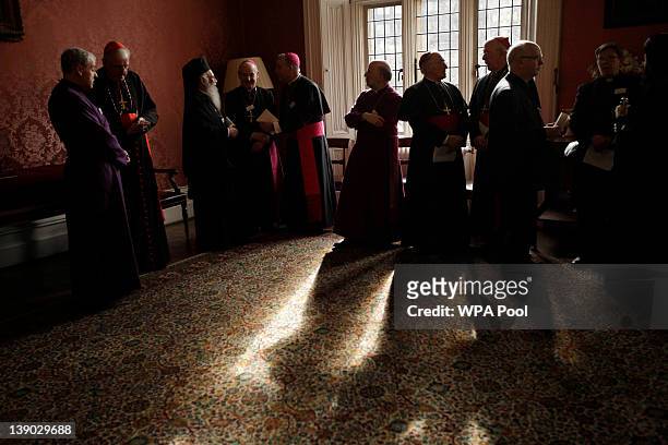 Christian guests wait in a room to meet Britain's Queen Elizabeth II at a multi-faith reception at Lambeth Palace on February 15, 2012 in London,...