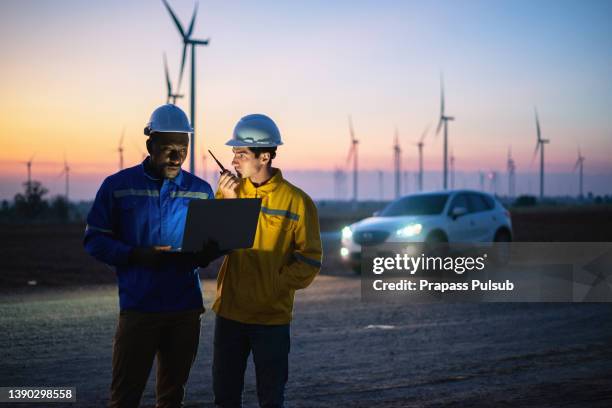 maintenance engineer team working in wind turbine farm - walkie talkie stock pictures, royalty-free photos & images