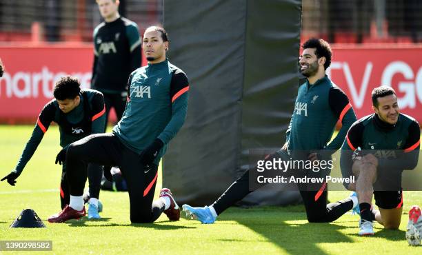 Virgil van Dijk and Mohamed Salah of Liverpool during a training session at AXA Training Centre on April 08, 2022 in Kirkby, England.