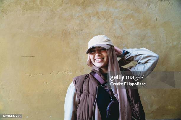 portrait of a young adult woman against a yellow background - funky stock pictures, royalty-free photos & images