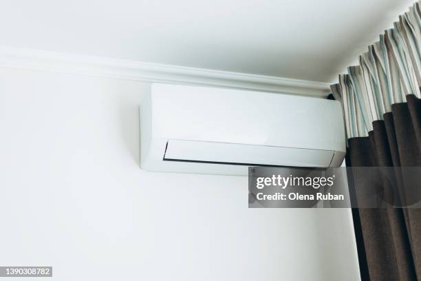 air conditioner and curtain. - bedroom ceiling stock pictures, royalty-free photos & images