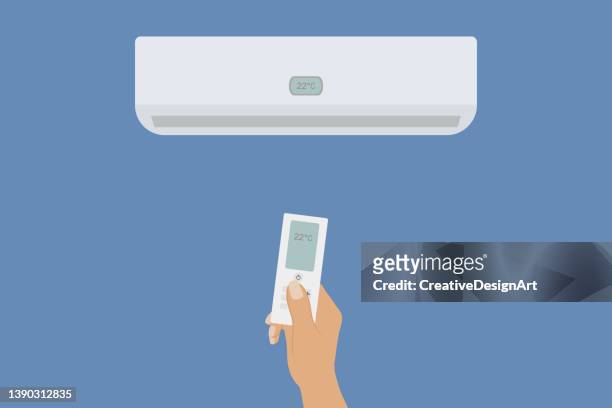 エアコンのリモートコントロールを保持する人間の手で青い背景にエアコン。 - 室内　エアコン点のイラスト素材／クリップアート素材／マンガ素材／アイコン素材