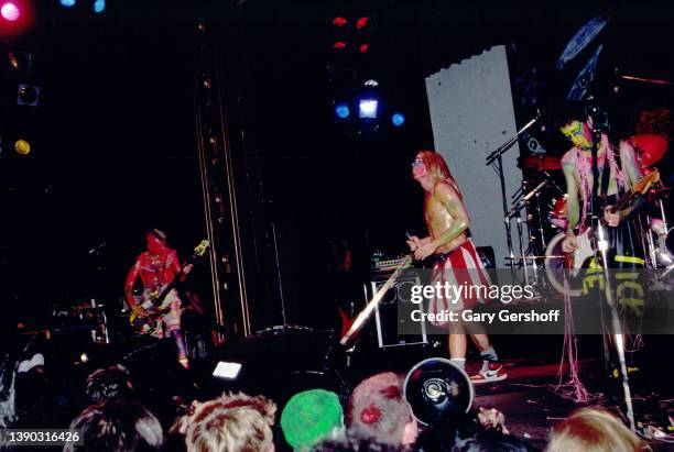 Members of American Rock group Red Hot Chili Peppers perform onstage at the Ritz, New York, New York, October 31, 1985. Pictured are, from left, Flea...