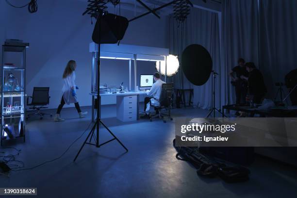 a backstage from filming a movie or a photoset with a scientific laboratory decorations - actor backstage stock pictures, royalty-free photos & images