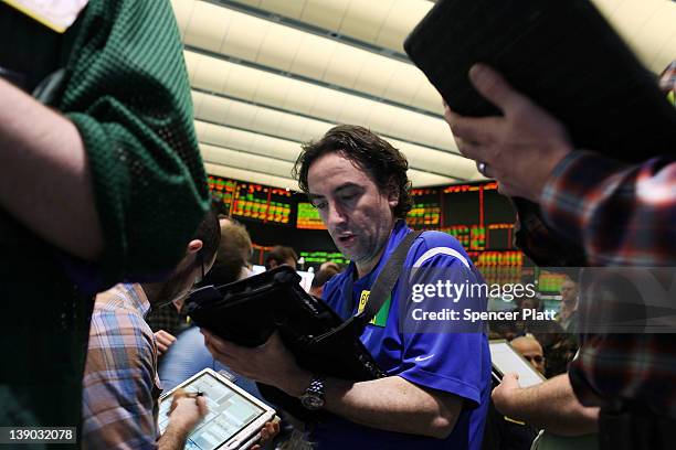 Oil traders work on the floor of the New York Mercantile Exchange on February 15, 2012 in New York City. As Iran reportedly may have cut oil exports...