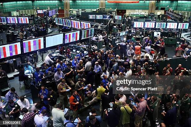 Oil traders work on the floor of the New York Mercantile Exchange on February 15, 2012 in New York City. As Iran reportedly may have cut oil exports...