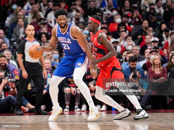 Joel Embiid of the Philadelphia 76ers is guarded by Pascal Siakam of the Toronto Raptors during the second half of their basketball game at the...