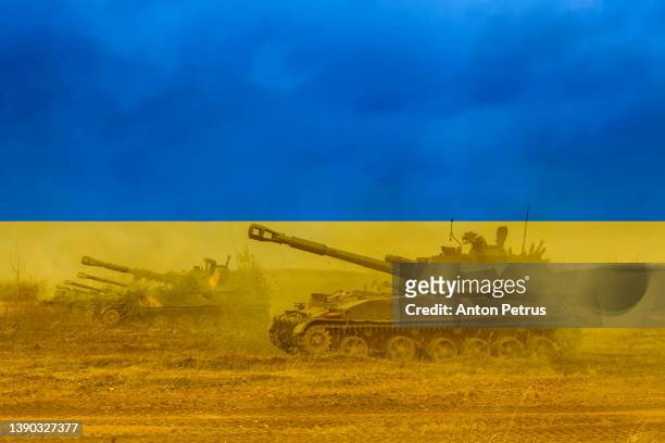 russian invasion of ukraine. ukrainian flag - konflikt stock-fotos und bilder