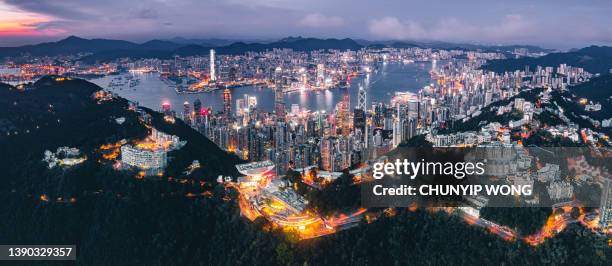 cityscape at victoria harbour in hong kong - development summit stock pictures, royalty-free photos & images