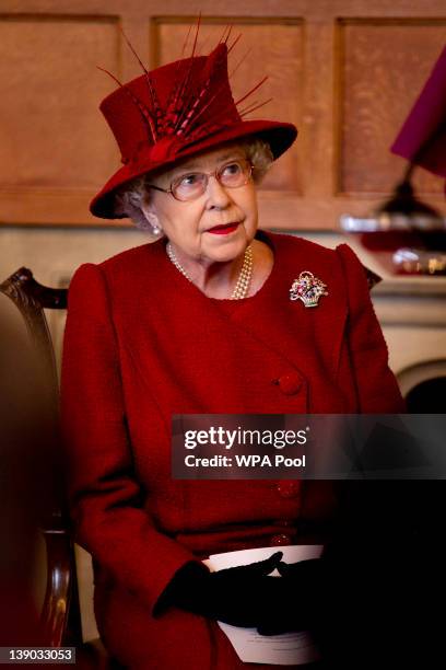 Queen Elizabeth II listens as the Archbishop of Canterbury Rowan Williams makes a speech during a multi-faith reception to mark the Diamond Jubilee...