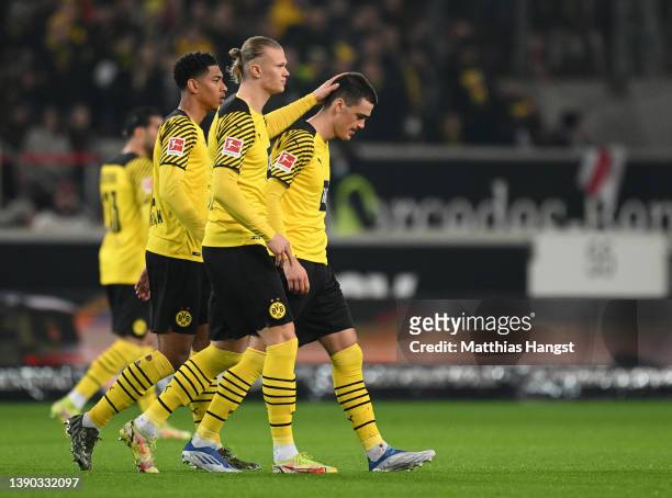 Erling Haaland consoles Giovanni Reyna of Dortmund who walks off the picth very soon after the start during the Bundesliga match between VfB...
