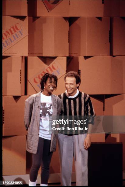 Comedians Billy Crystal and Whoopi Goldberg perform during 'Comic Relief' fundraising concert, March 29, 1986 at Universal Amphitheater in Los...