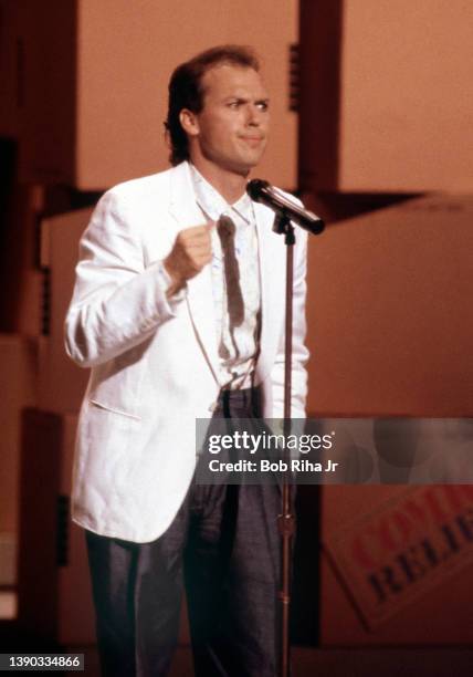 Comedian and actor Michael Keaton performs during 'Comic Relief' fundraising concert, March 29, 1986 at Universal Amphitheater in Los Angeles,...