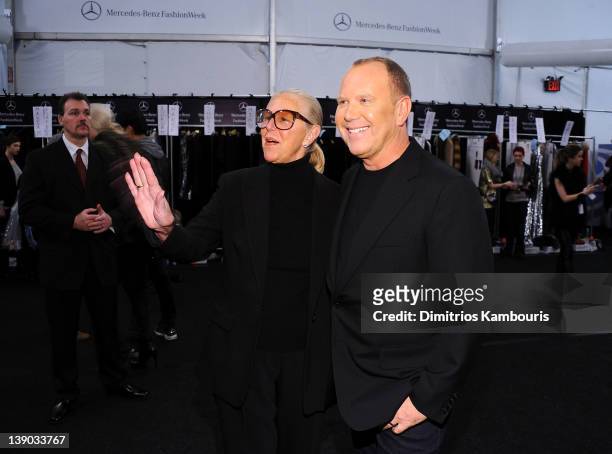 Joan Kors and designer Michael Kors pose backstage at the Michael Kors Fall 2012 fashion show during Mercedes-Benz Fashion Week at The Theatre at...