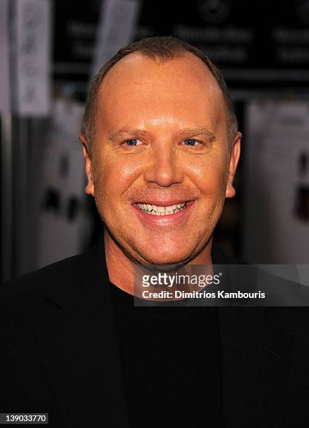 Designer Michael Kors prepares backstage at the Michael Kors Fall 2012 fashion show during Mercedes-Benz Fashion Week at The Theatre at Lincoln...