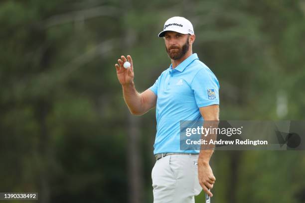 Dustin Johnson reacts after making par on the 18th green during the second round of The Masters at Augusta National Golf Club on April 08, 2022 in...