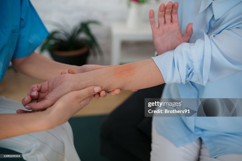 Medical staff treating a skin condition