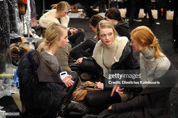 Models prepare backstage at the Michael Kors Fall 2012 fashion show during Mercedes-Benz Fashion Week at The Theatre at Lincoln Center on February...