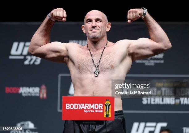 Aleksei Oleinik of Russia poses on the scale during the UFC 273 ceremonial weigh-in at VyStar Veterans Memorial Arena on April 08, 2022 in...