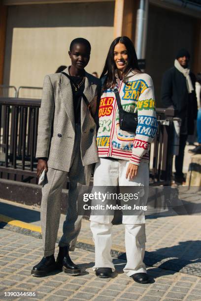 Models Akon Changkou and Grace Valentine after the Chanel show at Grand Palais Éphémère during Paris Fashion Week Fall/Winter 2022 on March 08, 2022...