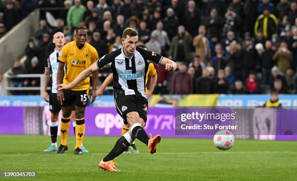 Chris Wood of Newcastle United scores their side's first goal from the penalty spot during the Premier League match between Newcastle United and...