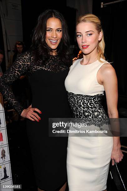 Actresses Paula Patton and Amber Heard pose backstage at the Michael Kors Fall 2012 fashion show during Mercedes-Benz Fashion Week at The Theatre at...