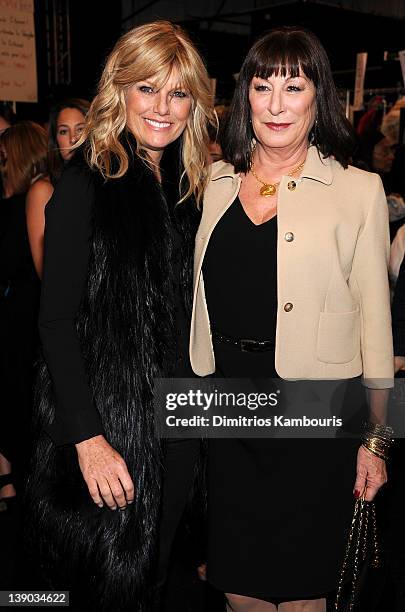 Patti Hansen and actress Anjelica Huston pose backstage at the Michael Kors Fall 2012 fashion show during Mercedes-Benz Fashion Week at The Theatre...