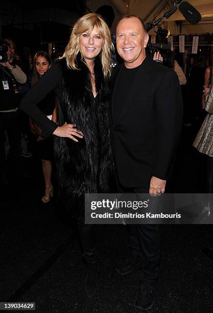 Patti Hansen and designer Michael Kors pose backstage at the Michael Kors Fall 2012 fashion show during Mercedes-Benz Fashion Week at The Theatre at...