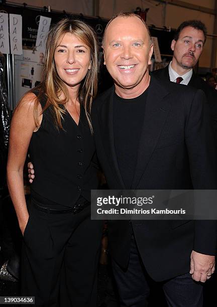 Nina Garcia and designer Michael Kors pose backstage at the Michael Kors Fall 2012 fashion show during Mercedes-Benz Fashion Week at The Theatre at...