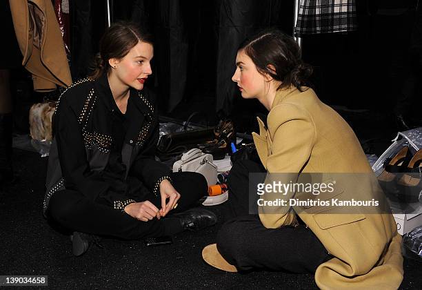Models prepare backstage at the Michael Kors Fall 2012 fashion show during Mercedes-Benz Fashion Week at The Theatre at Lincoln Center on February...