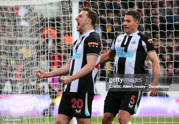 Chris Wood of Newcastle United celebrates with Fabian Scha after scoring the opening goal from the penalty spot during the Premier League match...