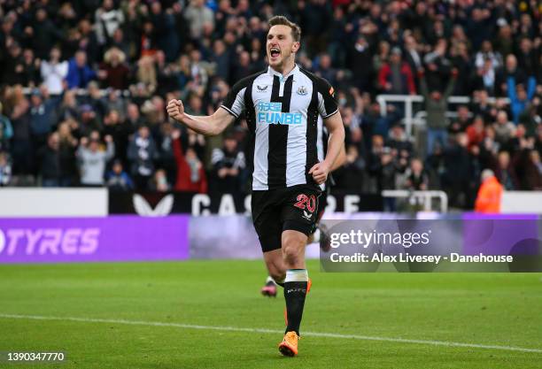 Chris Wood of Newcastle United celebrates after scoring the opening goal from the penalty spot during the Premier League match between Newcastle...