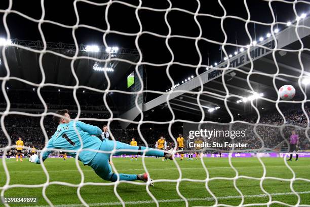 Jose Sa of Wolverhampton Wanderers fails to save a penalty took by Chris Wood of Newcastle United as he scores their side's first goal during the...