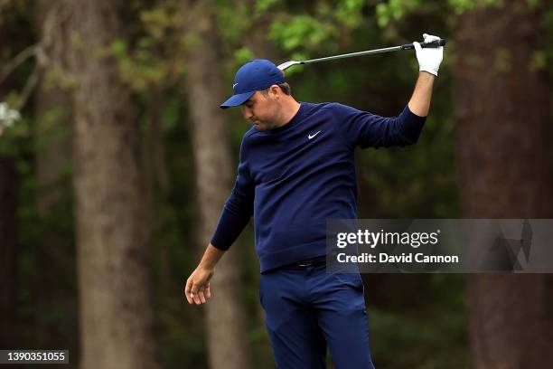 Scottie Scheffler reacts to his shot on the 17th hole during the second round of The Masters at Augusta National Golf Club on April 08, 2022 in...