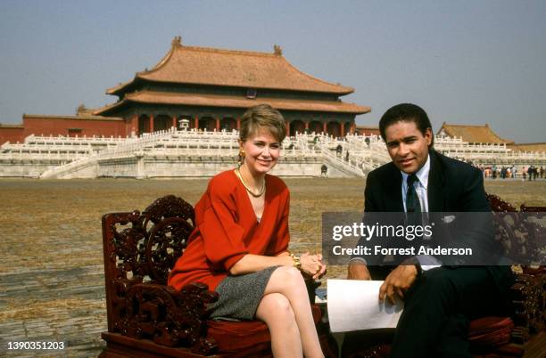 Portrait of American broadcast journalists and NBC television news anchors Jane Pauley and Bryant Gumbel at the Forbidden City, Beijing, China,...