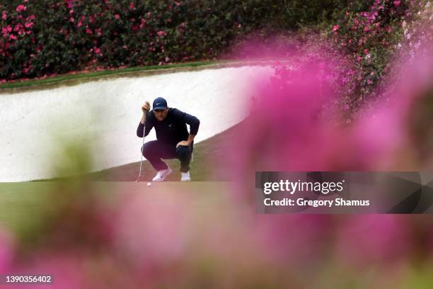 Scottie Scheffler lines up a putt on the 13th green during the second round of The Masters at Augusta National Golf Club on April 08, 2022 in...