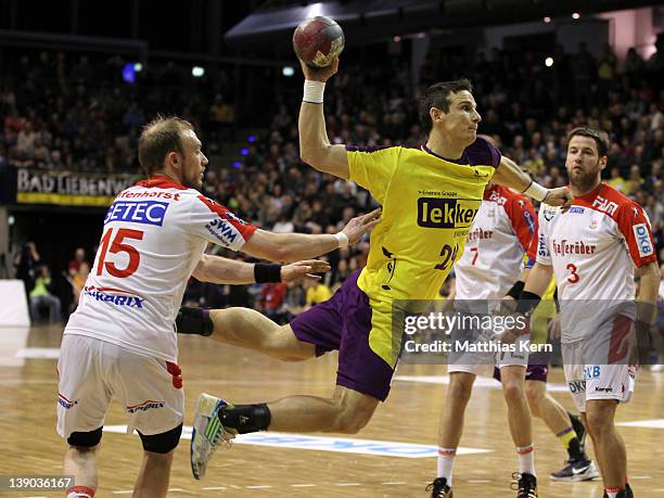 Bartlomiej Jaszka of Berlin is attacked by Yves Grafenhorst of Magdeburg during the Toyota Handball Bundesliga match between Fuechse Berlin and SC...